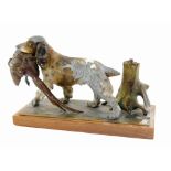 A Continental cold painted spelter stike lighter, modeled in the form of a spaniel with a pheasant,