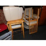 A cream leather reclining armchair and footstool, together with a table and two chairs. (5)