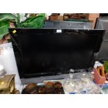 A Humax 31" flat screen television, with remote.