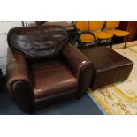 A brown leather armchair, together with a matching pouffe. (2)