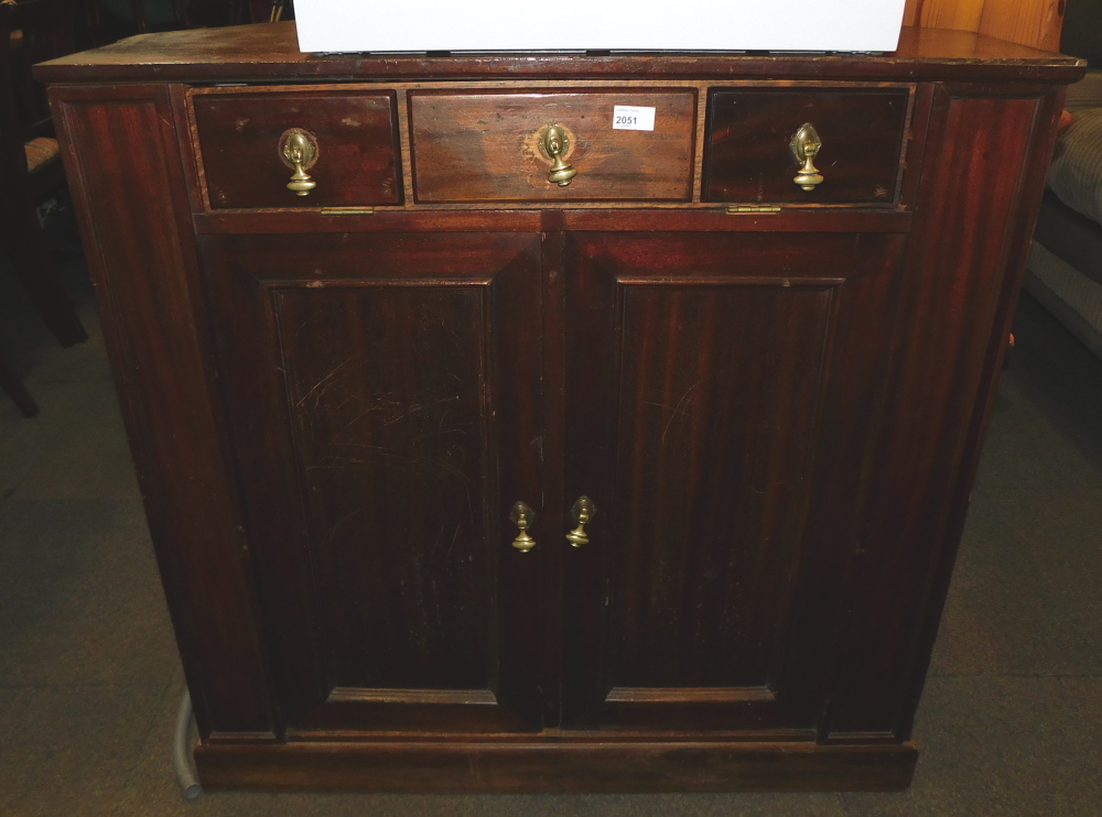 An early 20thC pine corner side cabinet, later converted to a television stand.