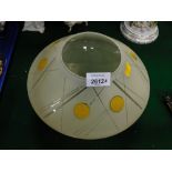 An Art Deco style glass light shade or bowl, with lemon print design, 19cm high.