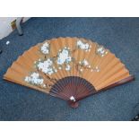 An Oriental painted fan.