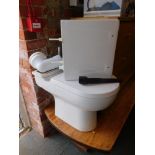 A white ceramic lavatory with soft close seat.