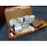 A Singer cased electric sewing machine, model WM 298D-9.