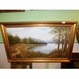 A continental oil on canvas of a forest and mountain landscape, gilt framed.