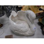 A white glazed pottery planter modelled as a swan.