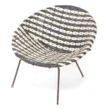 A 1960's plastic woven child's chair, with black metal base, in the manner of Conran.