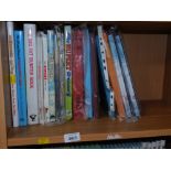 A group of Rupert, Paddington Bear and other annuals and books. (1 shelf)