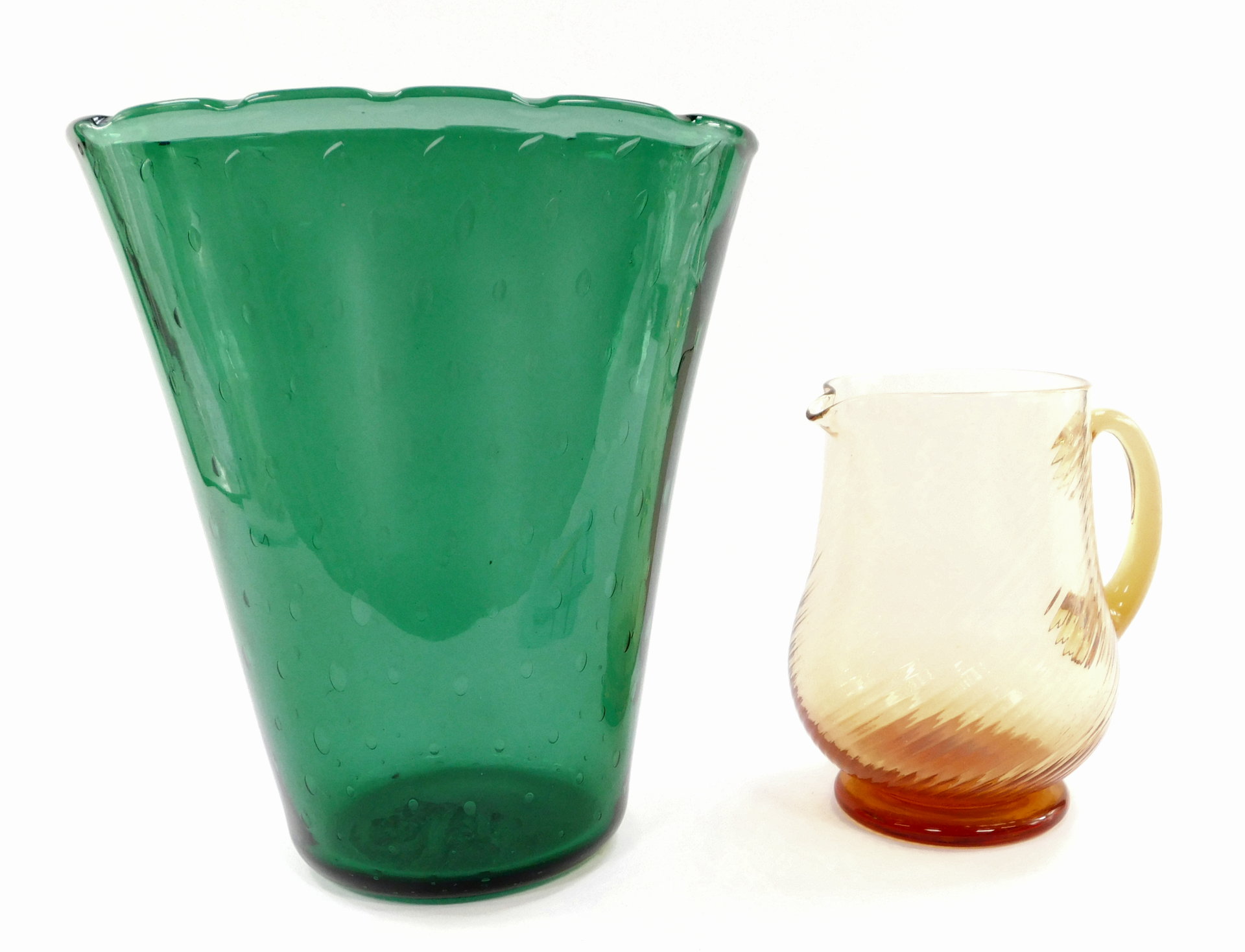 A Whitefriars type green flared vase, with bubble inclusions, 29.5cm high, together with an amber ti