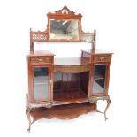 A Victorian mahogany mirror back display cabinet, the raised back with a rectangular mirrored plate,