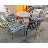 A patio table, together with five cast metal armchairs. (6)