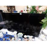 A Panasonic 41" flatscreen television, with remote.