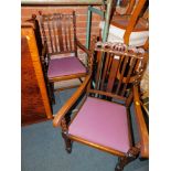 A pair of early 20thC oak carver dining chairs, with crown carved back rails, raised on barley twist