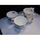 Three Royal Doulton Bunnykins tea cups, to include The Birthday., The Dairy., and The Birthday with