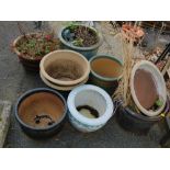 Seven glazed plant pots.