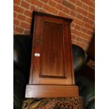 A Victorian walnut pot cupboard.