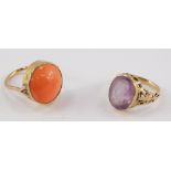 A coral ring, set in yellow metal, size N, together with an amethyst glass set ring in yellow metal,