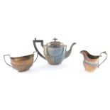 An Edward VII silver plated semi fluted three piece teaset, presentation engraved "Awarded to the Ex