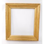 A 19thC gilt wood and gesso picture frame, aperture 75cm x 64cm, frame 103cm x 92.5cm.
