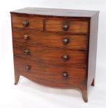 A late Georgian mahogany bowfront chest, with a plum pudding mahogany top, two short over three lon