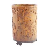 A Chinese Republic bamboo brush pot, carved in relief with Confucius, a dragon and trees, on an inte