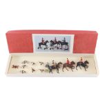 A Britains lead hunting set, comprising two huntsman and a huntswoman on horseback, standing huntswo