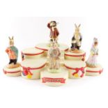 A Royal Doulton Bunnykins The Occasions Collections base, and five figures, comprising Airman Bunnyk