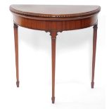 A Victorian style mahogany demilune fold over card table, raised on square tapering legs and spade f