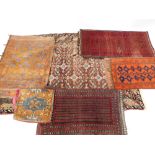 Six assorted Caucasian saddle bags and prayer and other rugs, various sizes.