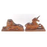 A pair of 19thC salt glazed flat back figures, of a lion and unicorn, each modelled recumbent on a s