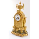 A French late 19thC Louis XVI style gilt metal cased mantel clock, circular enamel dial bearing Roma