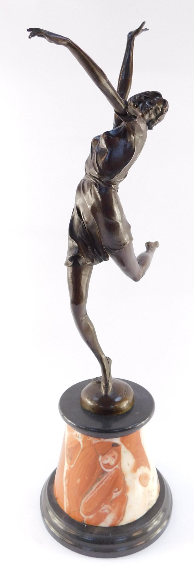 After Bruno Zach (Austrian, 1891-1945). A bronze sculpture of a dancing woman, raised on a black and