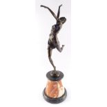 After Bruno Zach (Austrian, 1891-1945). A bronze sculpture of a dancing woman, raised on a black and