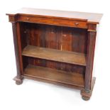 A George IV mahogany breakfront open bookcase, with a single frieze drawer above two shelves, raised