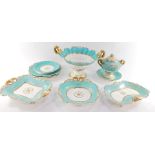 A Davenport early 19thC porcelain part dessert service, moulded with flowers, against a turquoise gr