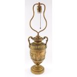 A neoclassical late 19thC loaded brass table lamp, of twin handled semi fluted urn form, decorated c