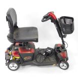 An Apex Rapid 4 wheel mobility scooter, with front basket and charger, in red and black trim.
