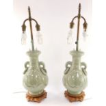 A pair of Chinese Republic celadon porcelain vases, converted to table lamps, of twin handled balust