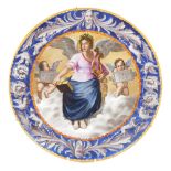 An Italian late 19thC maiolica charger, painted with an angel seated in heaven holding a lyre and a