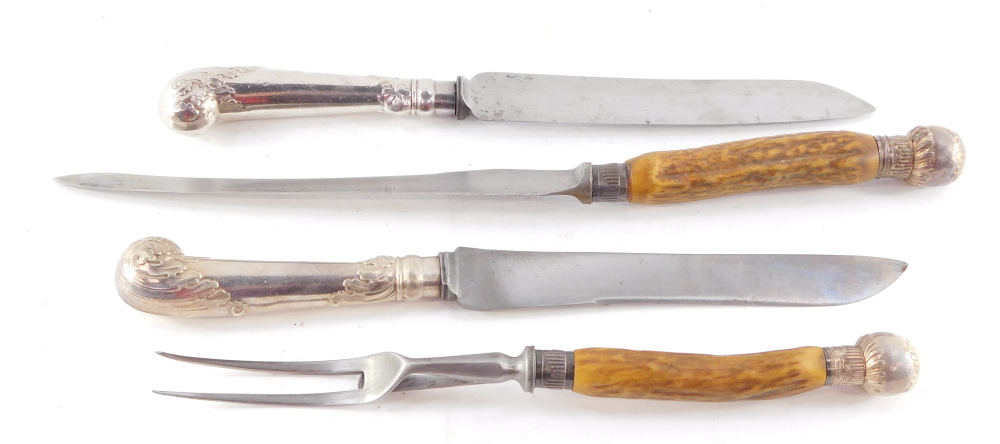 A pair of carving knives, with leaf embossed pistol handles, white metal, together with a George V h