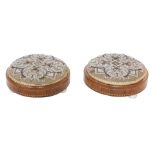 A pair of Victorian walnut and inlaid footstools, with bead worked decorated tops, raised on three p