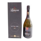 A bottle of Lanson champagne, extra aged, boxed.