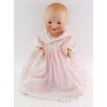 An Armand Marseille bisque head doll, 351/7K, modelled open mouthed, with blue eyes, jointed limbs,