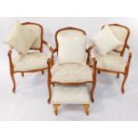 A set of three Louis XVI style pale stained oak carver chairs, with pale gold and overstuffed floral