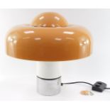 A Harvey Guzzini Brumbury 1970's metal and plastic table lamp, with a fibreglass shade, bears label