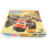 A Scalextric, including cars, track, etc., in a 12E set box.