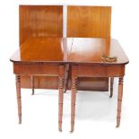 A George IV mahogany D end dining table, with two additional leaves, raised on turned legs, brass ca