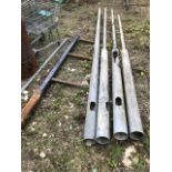 A three spike steel spur and four galvanized steel lamp standard posts. NB: This lot is situated 8