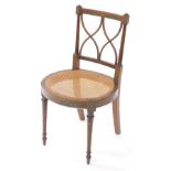 An Edwardian Sheraton style mahogany and painted bedroom chair, decorated with bands of flowers, wit